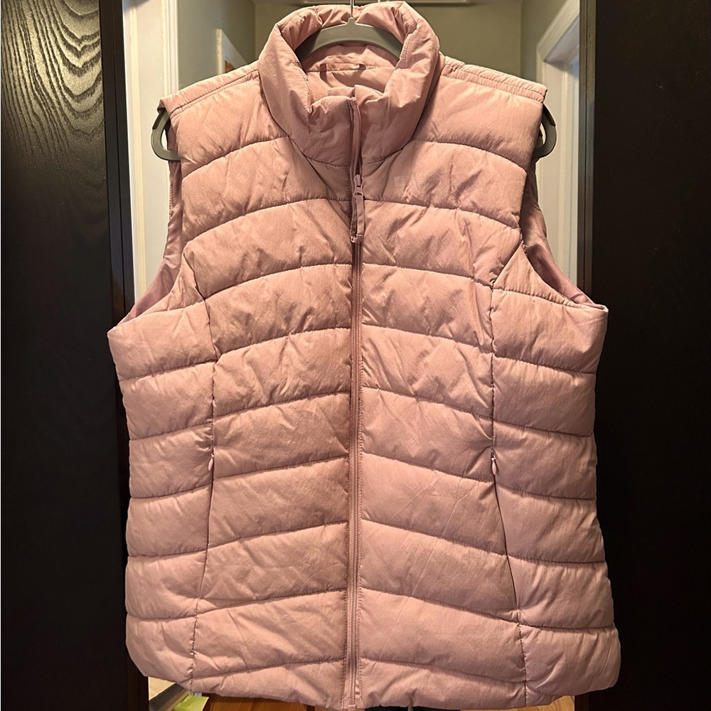 Light pink puffer vest. Runs large.